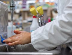 man washing hands in a lab