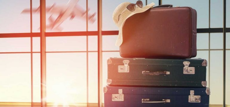 image showing luggage pictured in front of an airport window
